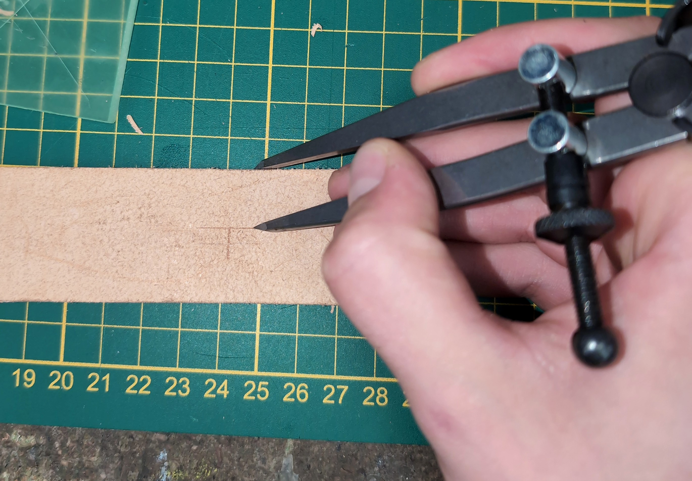 marking some guidelines to have an easier time aligning the prong's hole punch