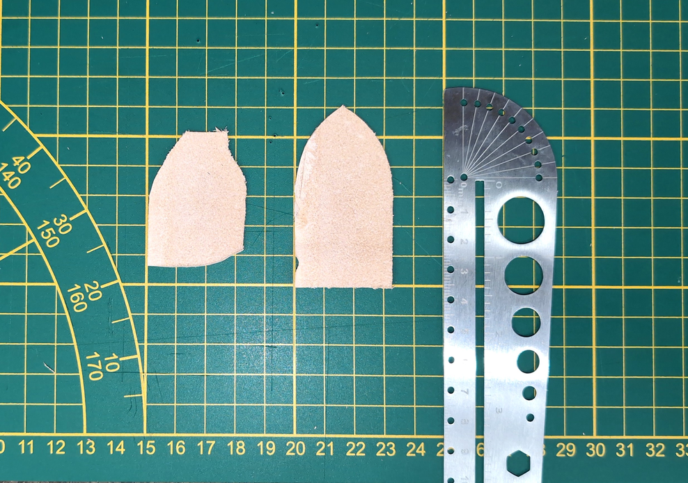 The result of holding the cutter knife in a really weird way and pulling the leather into it.