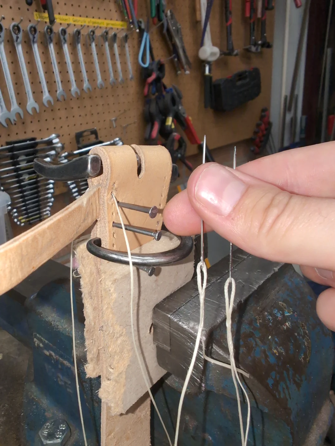 Beginning the stitch,one stitching hole away from the buckle.
