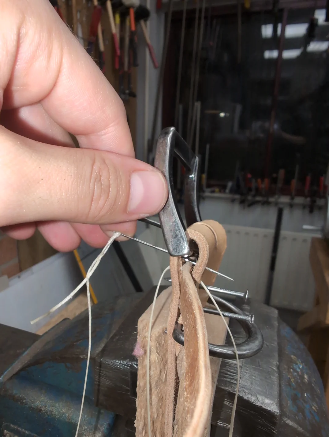 Stitching the stiching hole closest to the buckle.