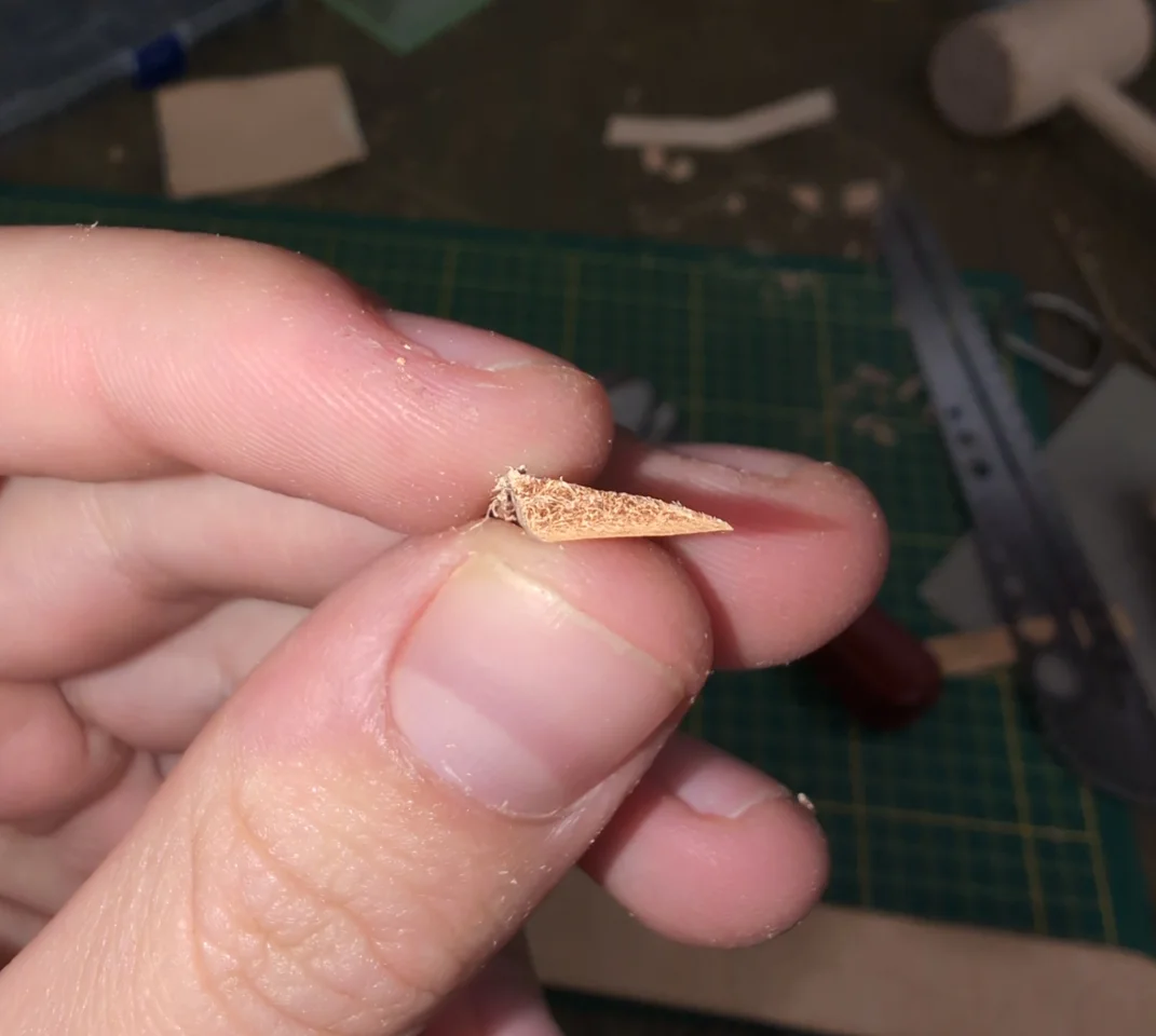 Skived piece of leather wedge (derogatory)